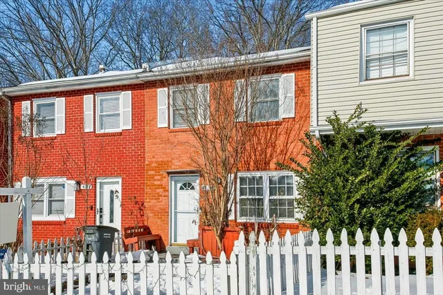 a front view of a house with a large windows