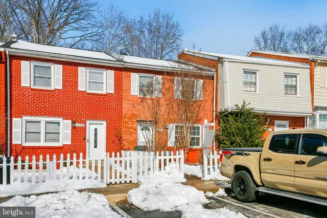 a view of a car park in front of a house