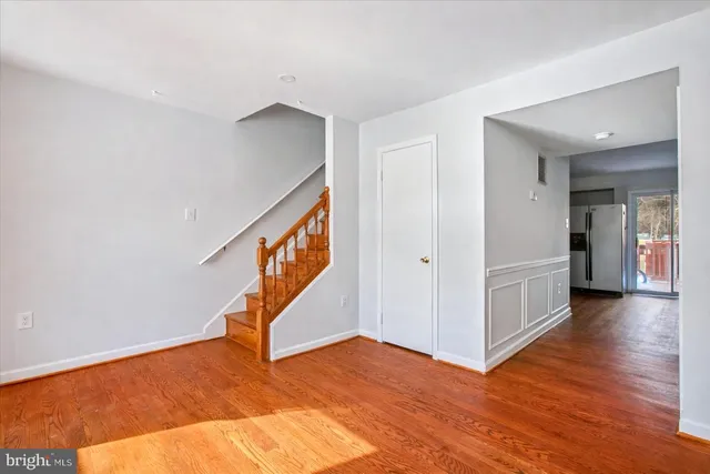 a view of an entryway with wooden floor