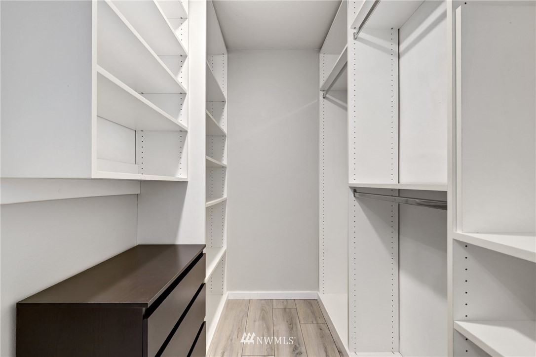 7001 Sand Point Way Northeast, Unit C309 Seattle, WA 98115 - Photo 13 of 38 a view of walk in closet with empty racks