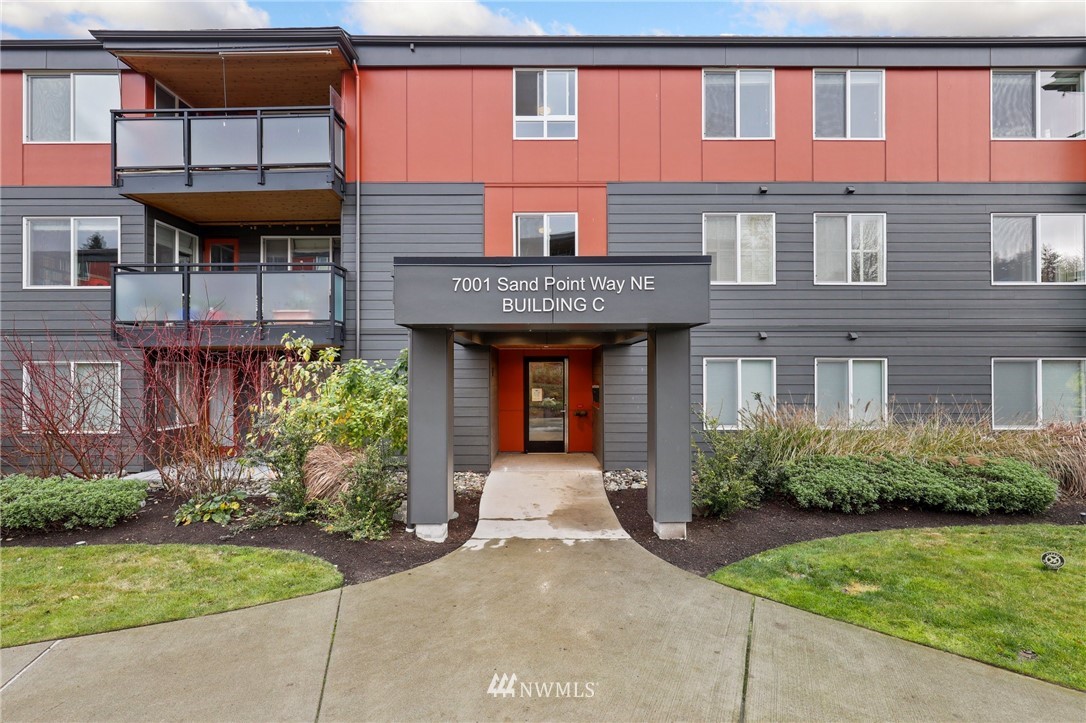 7001 Sand Point Way Northeast, Unit C309 Seattle, WA 98115 - Photo 21 of 38 a front view of a house with garden