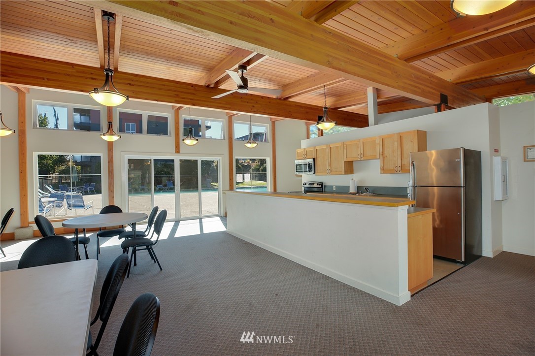 7001 Sand Point Way Northeast, Unit C309 Seattle, WA 98115 - Photo 29 of 38 a view of a kitchen with large windows