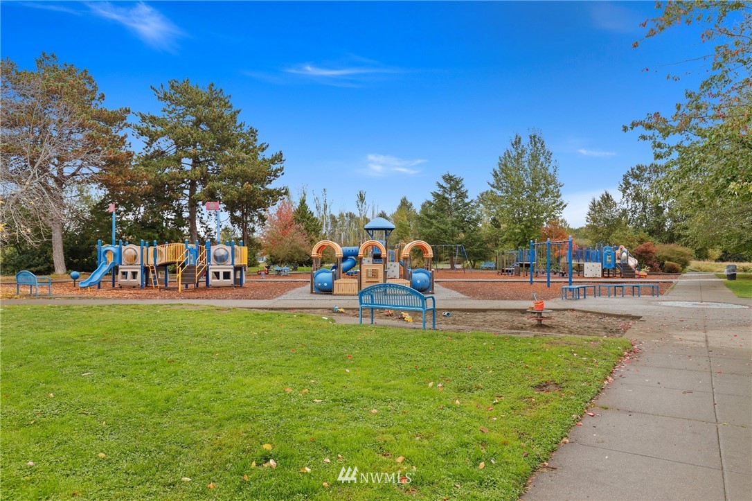 7001 Sand Point Way Northeast, Unit C309 Seattle, WA 98115 - Photo 30 of 38 a view of a park with large trees