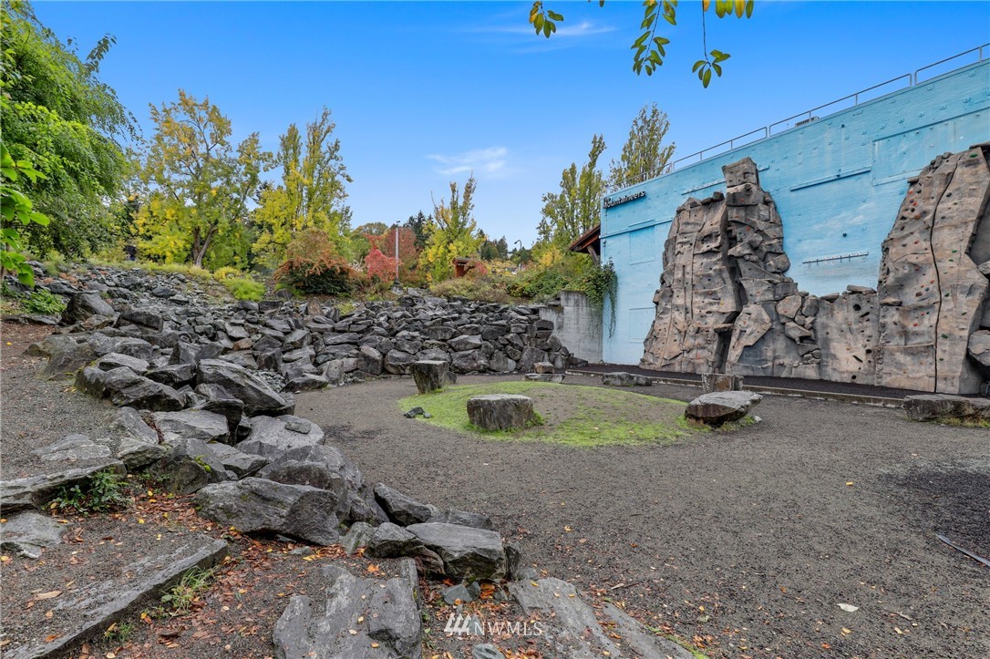 7001 Sand Point Way Northeast, Unit C309 Seattle, WA 98115 - Photo 33 of 38 a view of outdoor space with playground
