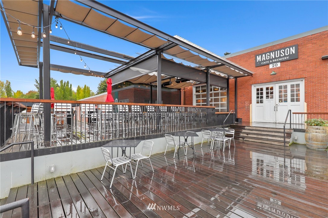 7001 Sand Point Way Northeast, Unit C309 Seattle, WA 98115 - Photo 36 of 38 a front view of a house with a patio