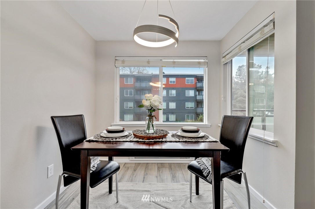 7001 Sand Point Way Northeast, Unit C309 Seattle, WA 98115 - Photo 9 of 38 a dining room with furniture and window