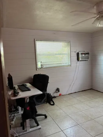 a workspace with furniture and window