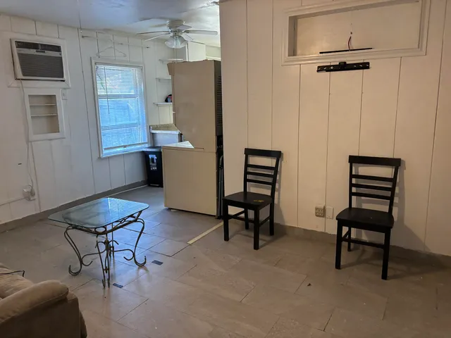 a room with furniture and a window