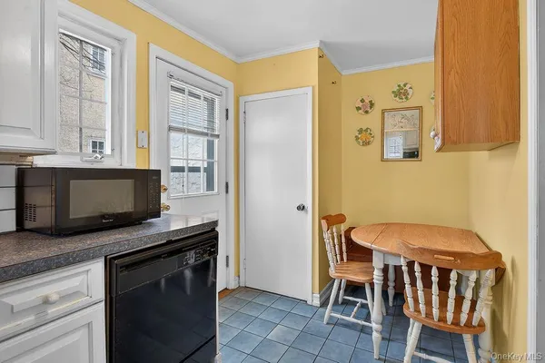 a kitchen with stainless steel appliances granite countertop a stove a microwave and a refrigerator