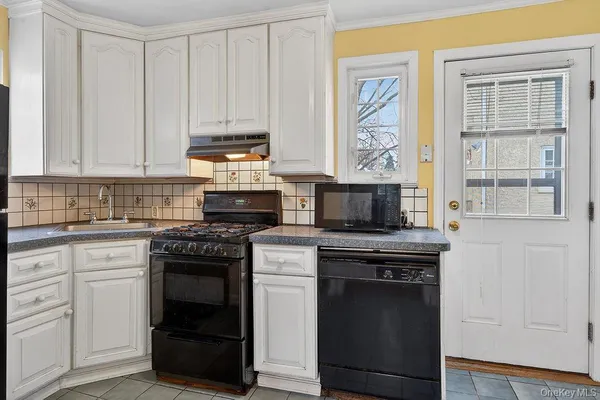 a kitchen with stainless steel appliances granite countertop a stove and a sink