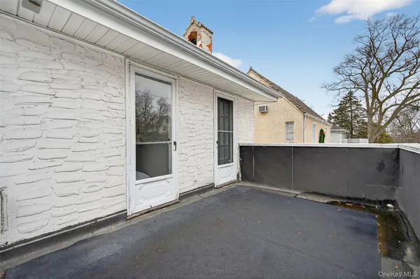 a view of a house with a street