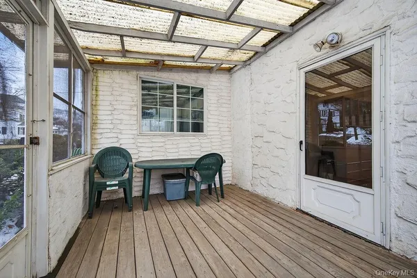 a view of a two chairs in the balcony
