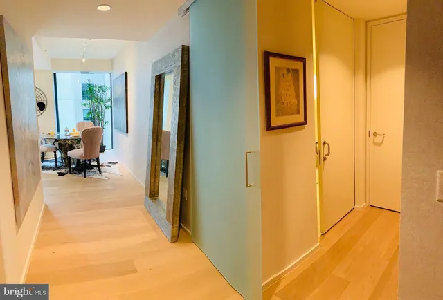 a view of a hallway with living room