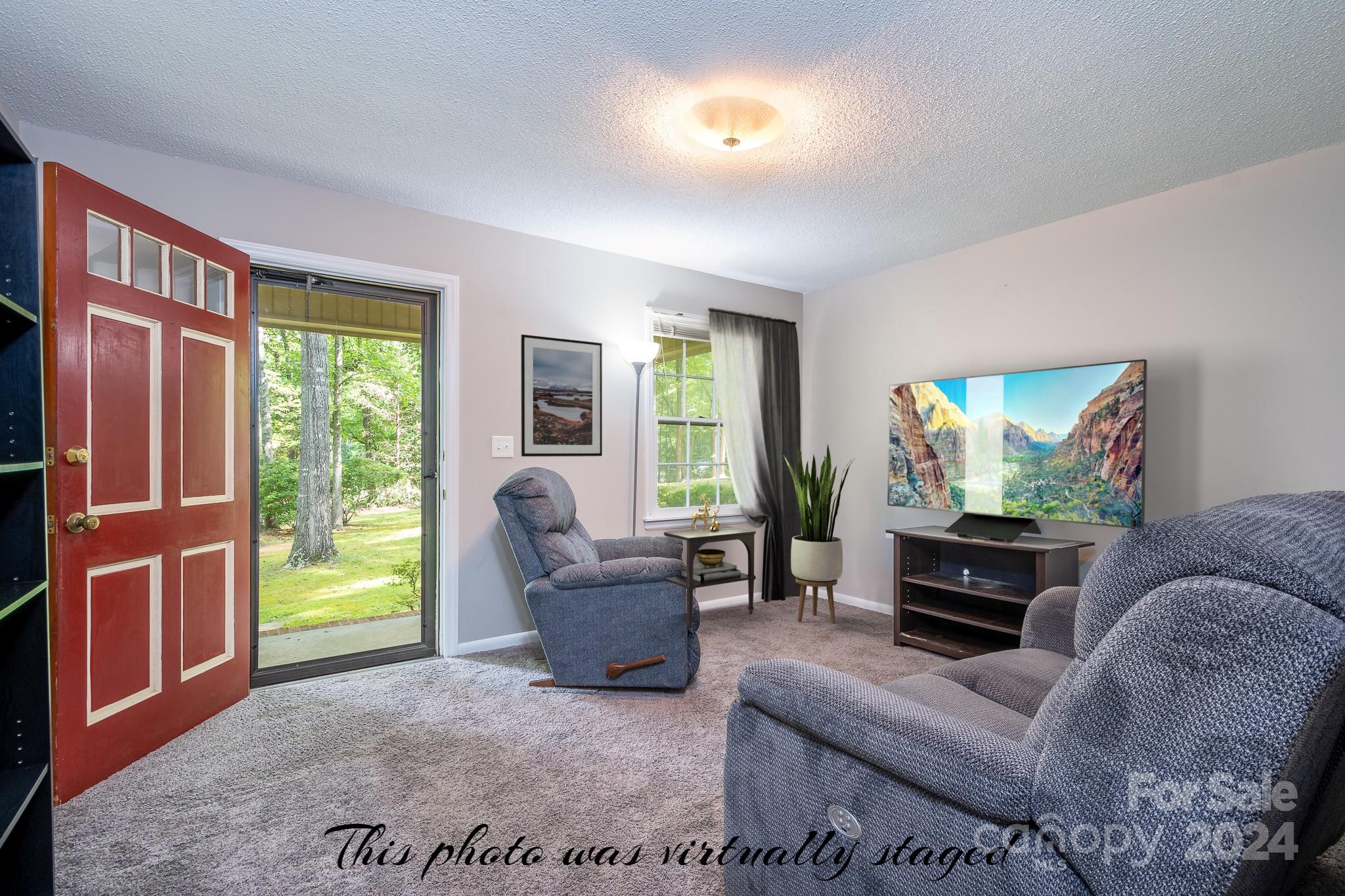 918 Blacksnake Road Stanley, NC 28164 - Photo 12 of 41 a living room with furniture and a window