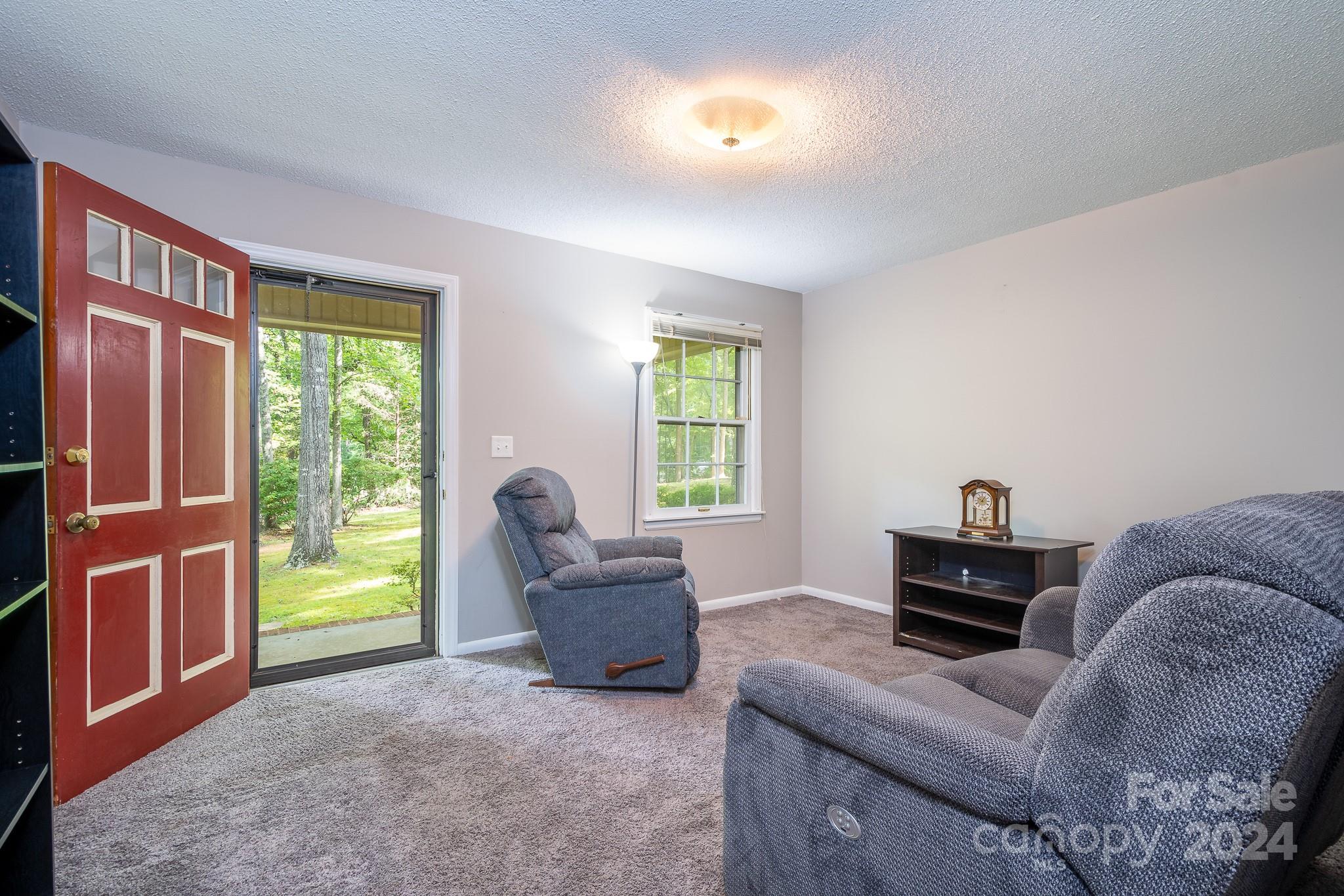 918 Blacksnake Road Stanley, NC 28164 - Photo 13 of 41 a living room with furniture and a window