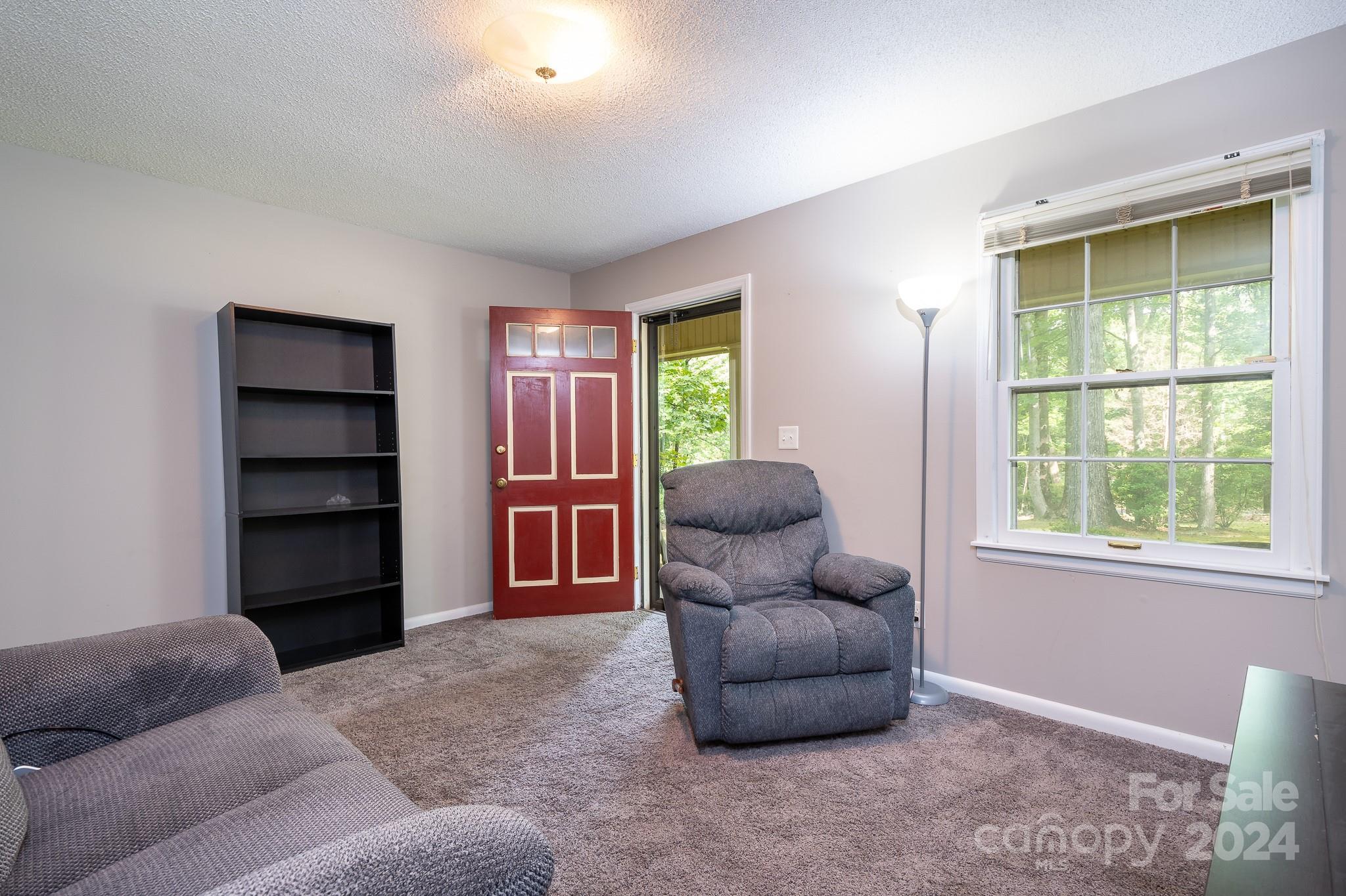 918 Blacksnake Road Stanley, NC 28164 - Photo 14 of 41 a living room with furniture and a window