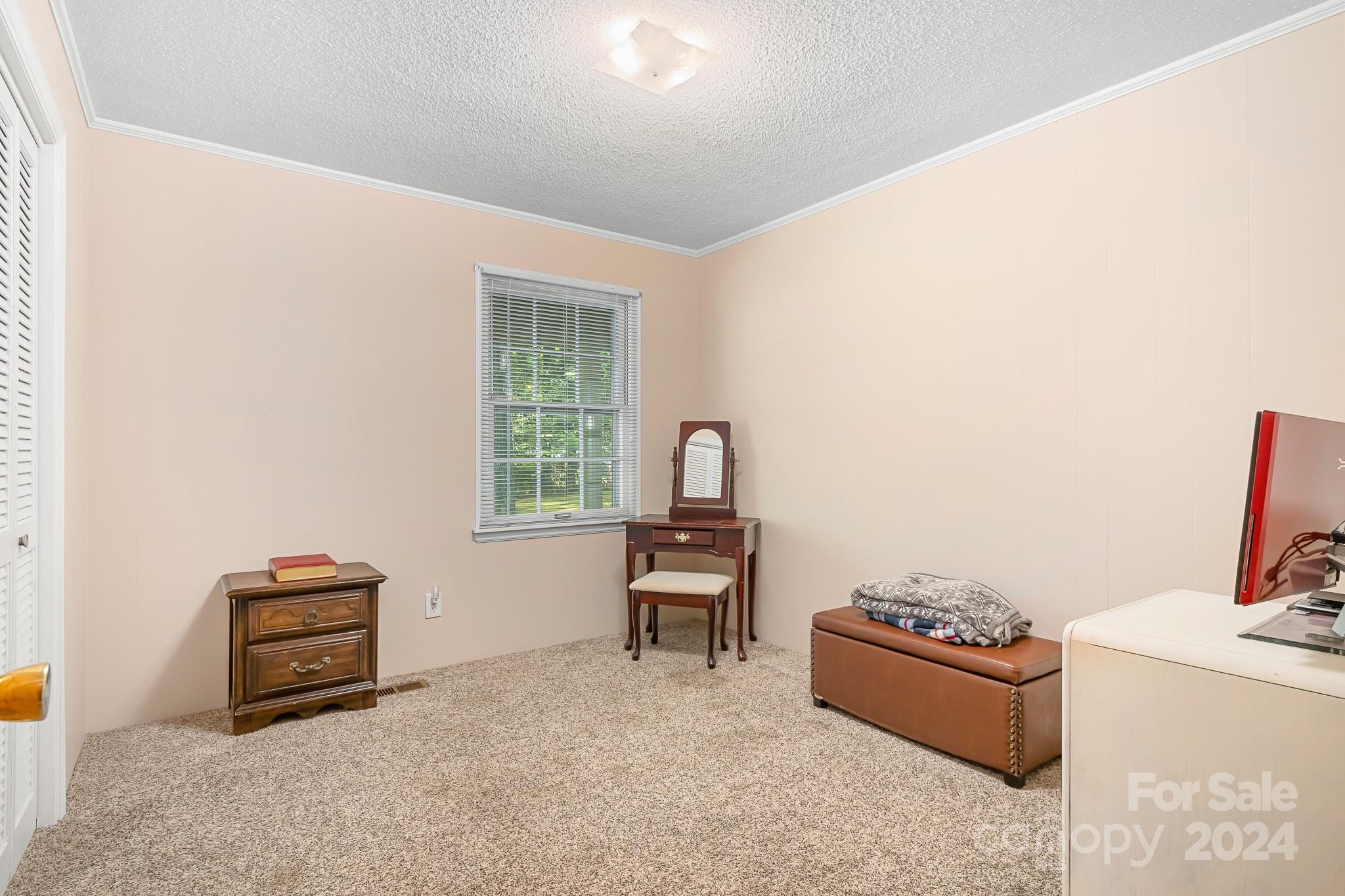 918 Blacksnake Road Stanley, NC 28164 - Photo 15 of 41 a living room with furniture and a window