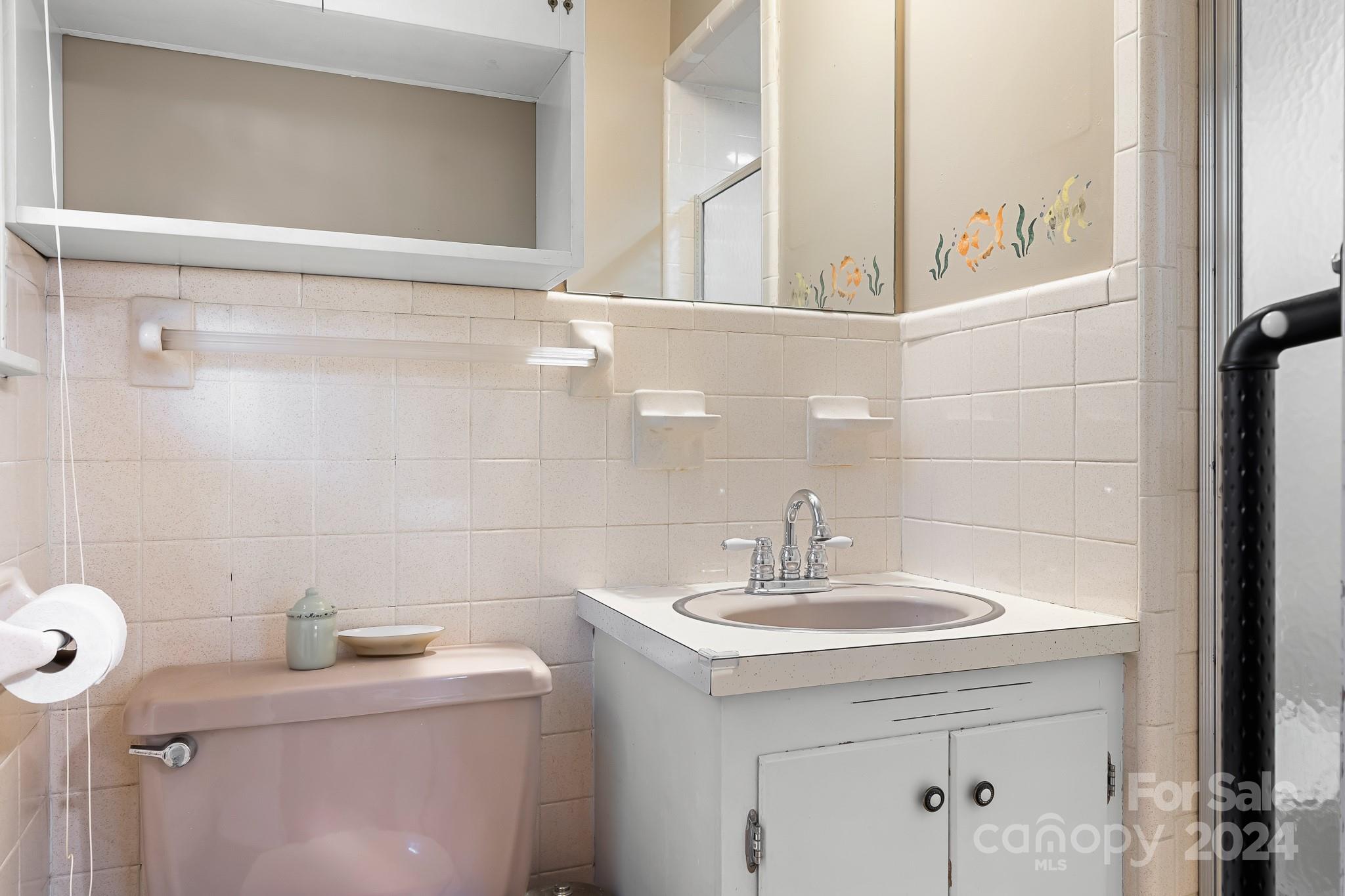 918 Blacksnake Road Stanley, NC 28164 - Photo 21 of 41 a bathroom with a sink a toilet and shower