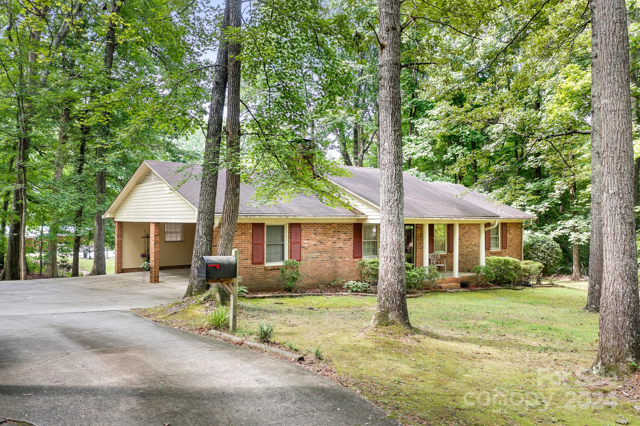 918 Blacksnake Road Stanley, NC 28164 - Photo 41 of 41 a view of a house with a yard and large tree