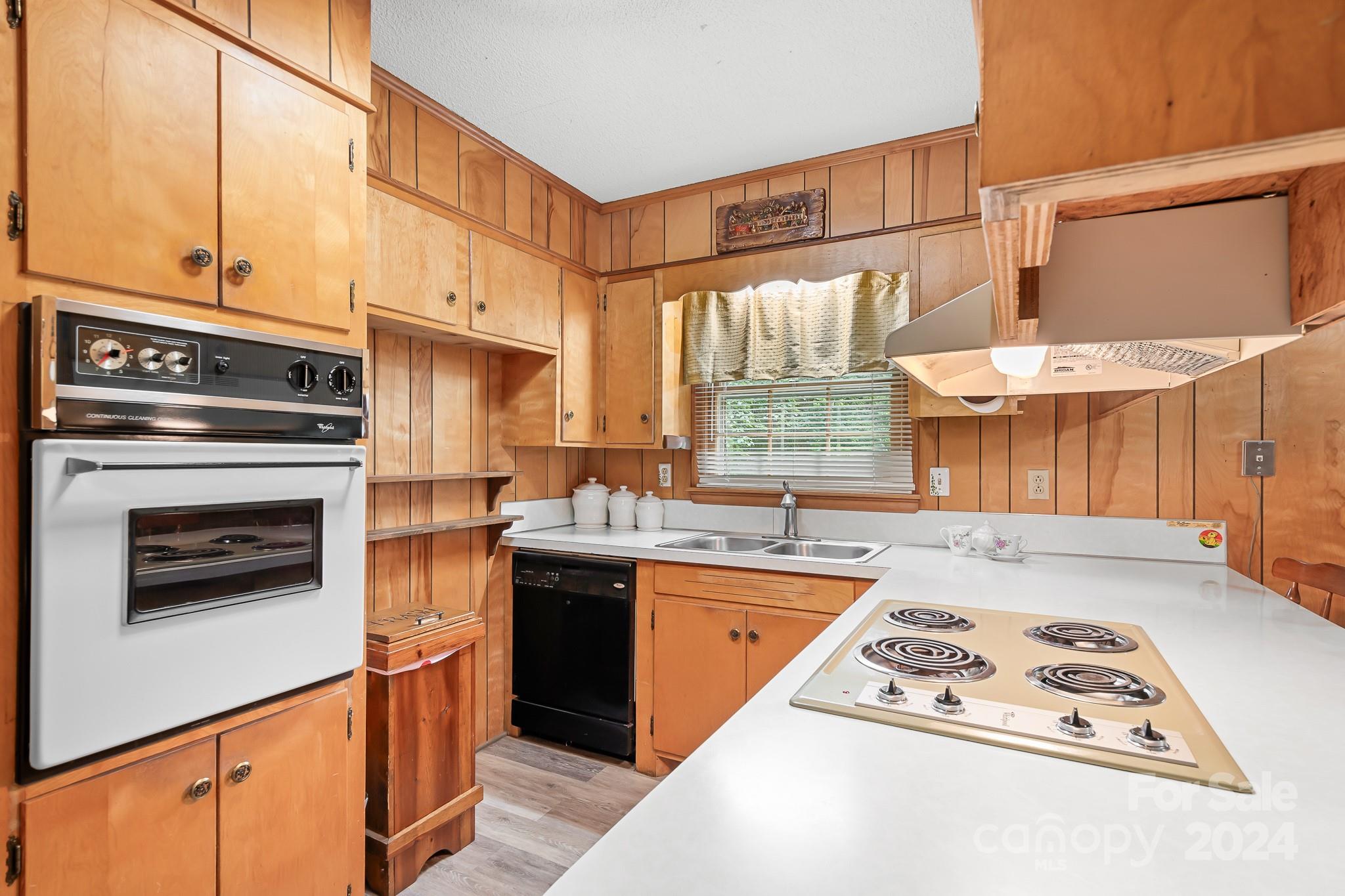 918 Blacksnake Road Stanley, NC 28164 - Photo 7 of 41 a kitchen with stainless steel appliances granite countertop a stove a sink and a microwave
