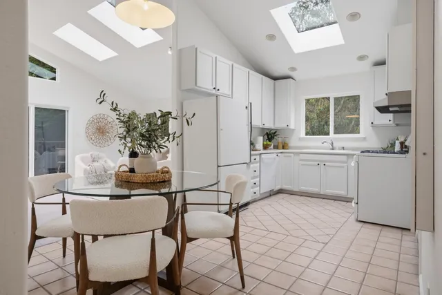 a kitchen with stainless steel appliances kitchen island granite countertop a sink and cabinets