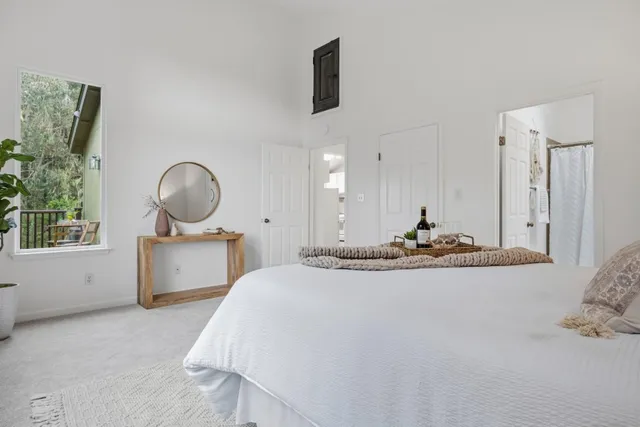 a view of living room and bedroom with furniture