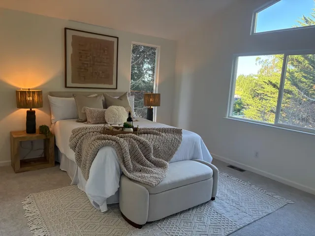 a bedroom with a bed and a couch