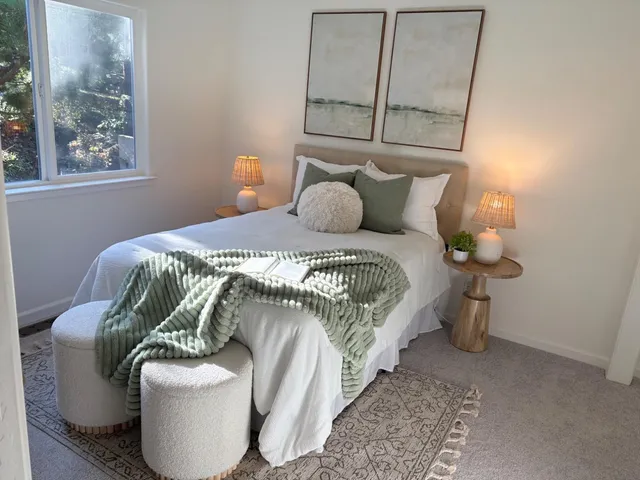 a bedroom with a bed and window