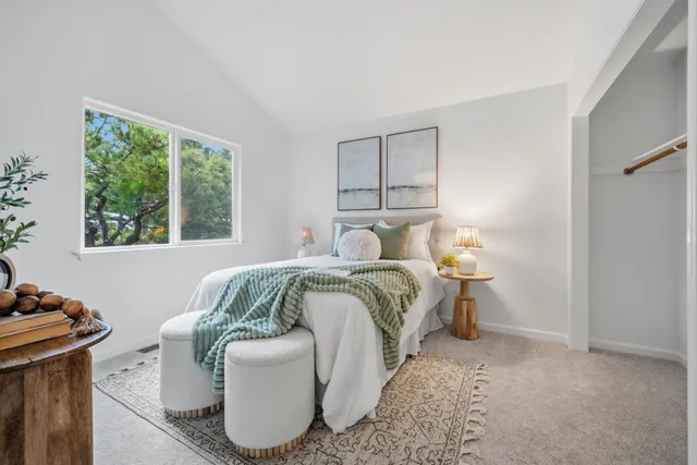 a bedroom with a bed and window