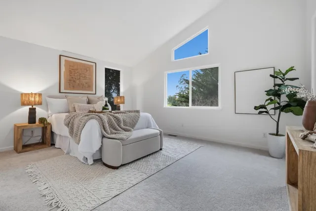 a bedroom with bed and a couch