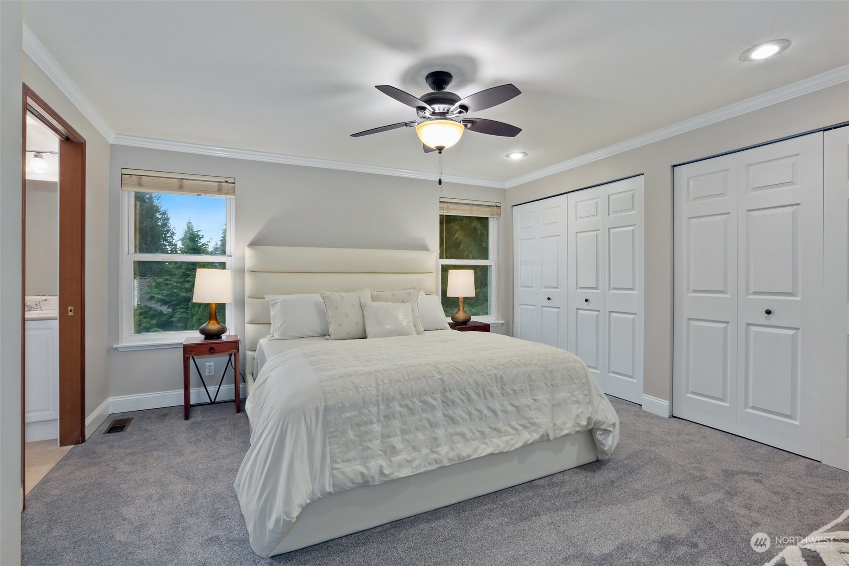 3004 170th Place Southeast Bothell, WA 98012 - Photo 13 of 25 a bedroom with a large bed and a chandelier