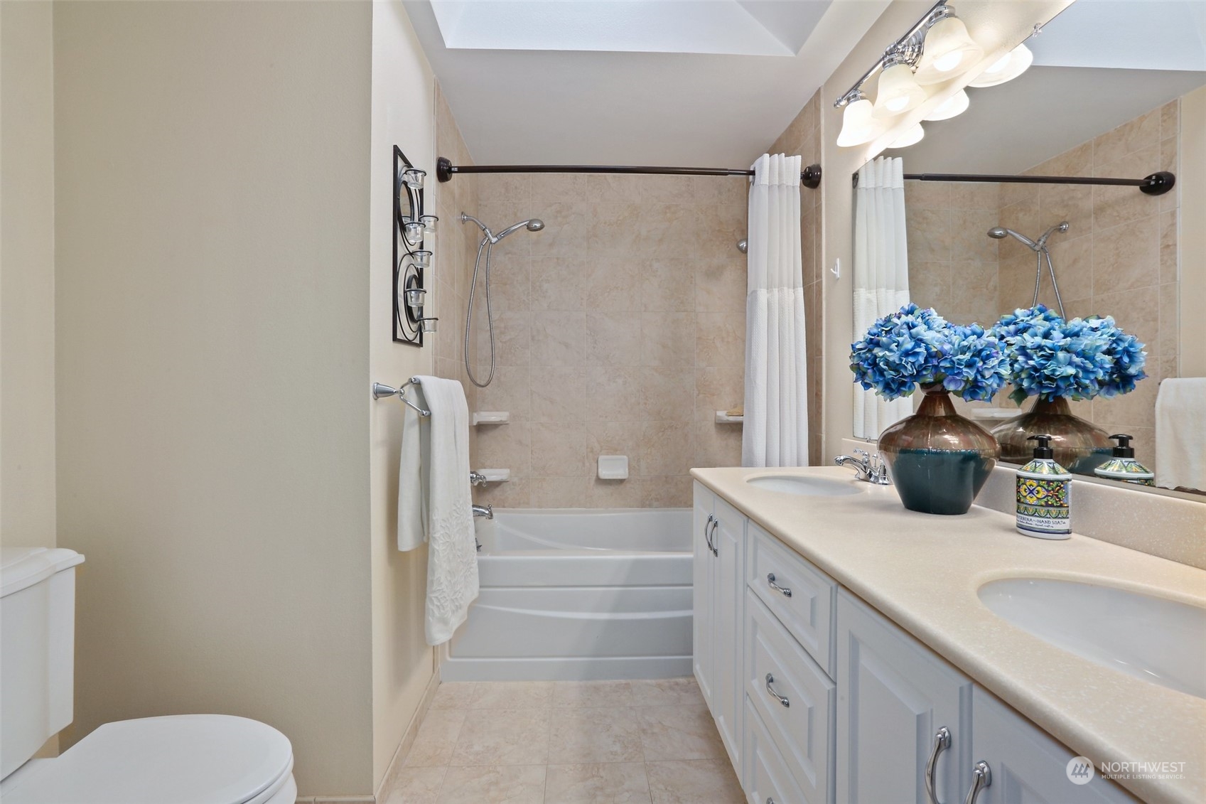 3004 170th Place Southeast Bothell, WA 98012 - Photo 14 of 25 a bathroom with a sink toilet and shower