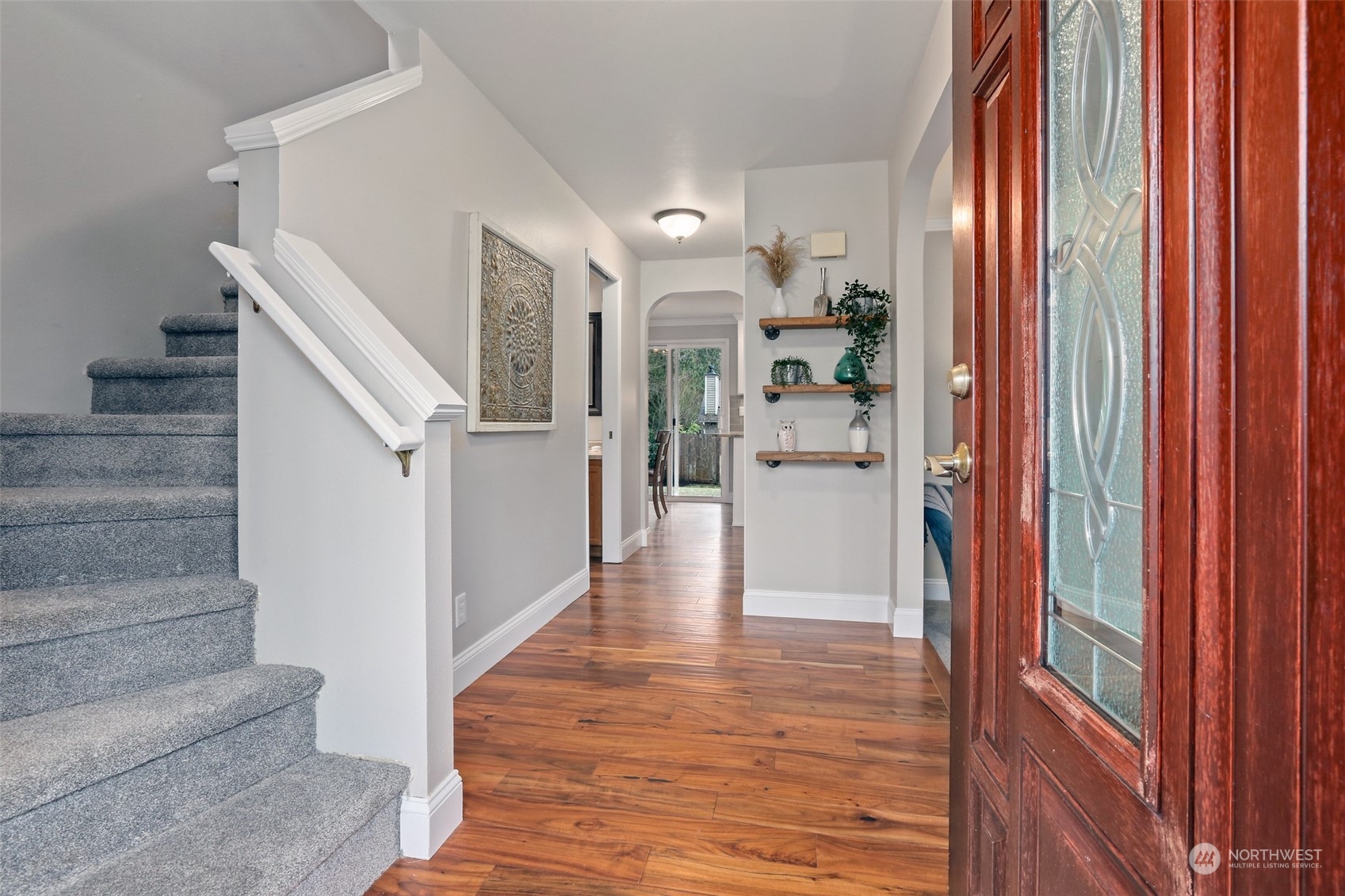 3004 170th Place Southeast Bothell, WA 98012 - Photo 3 of 25 a view of a hallway with wooden floor and staircase