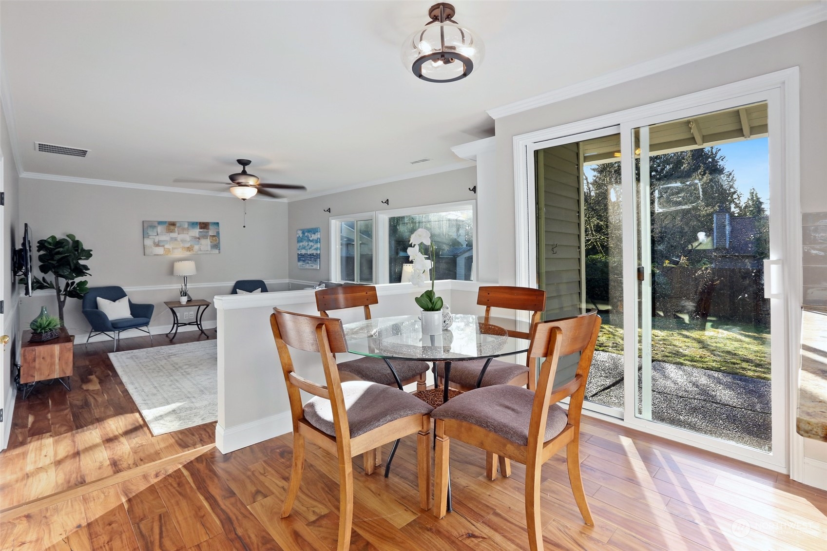 3004 170th Place Southeast Bothell, WA 98012 - Photo 7 of 25 a dining room with furniture a chandelier and wooden floor