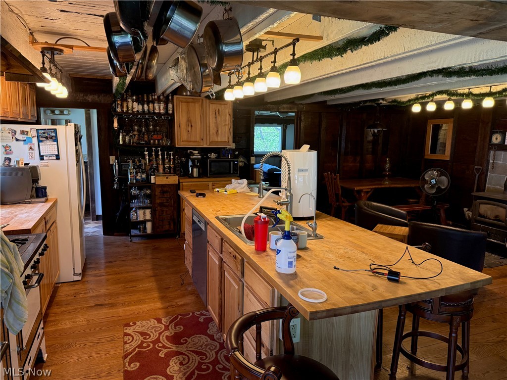 11811 Gaston Road Rogers, OH 44455 - Photo 26 of 38 Enjoy your time inside this cozy, functional, and equipped log cabin! You've already got the important utilities like electric, geo-thermal heat, a septic system installed 6 years ago, and private well water.
