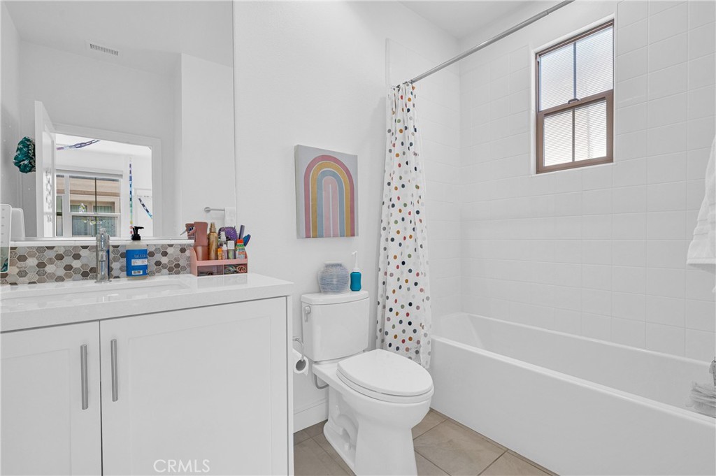 115 Halworth Irvine, CA 92618 - Photo 13 of 33 a bathroom with a sink toilet and shower