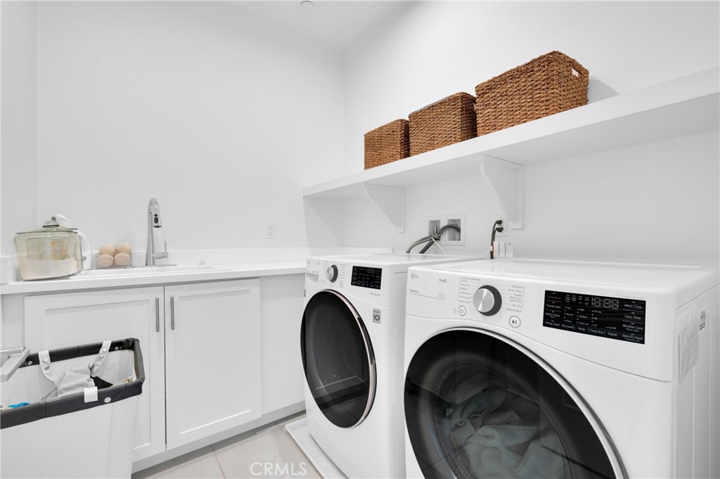 115 Halworth Irvine, CA 92618 - Photo 24 of 33 a utility room with dryer and washer