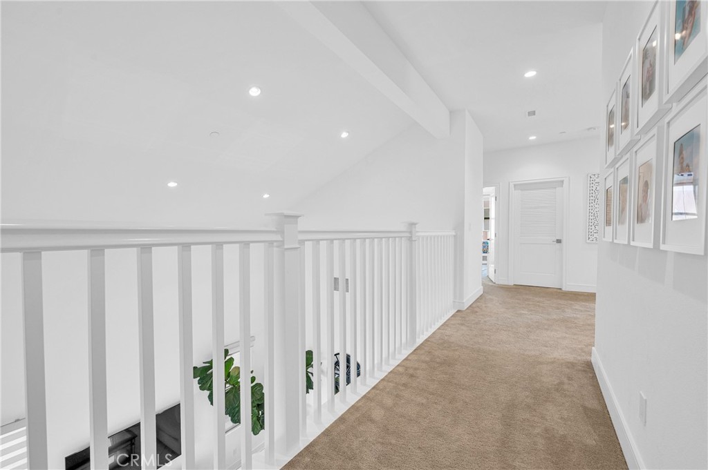 115 Halworth Irvine, CA 92618 - Photo 25 of 33 a view of a hallway with wooden floor and stairs