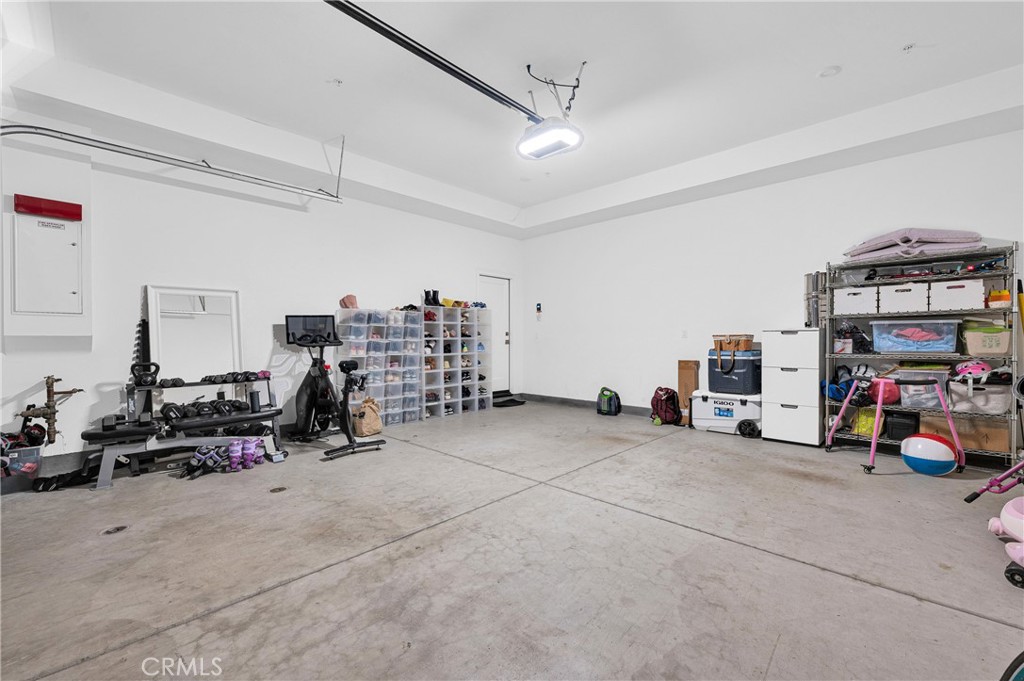115 Halworth Irvine, CA 92618 - Photo 27 of 33 a view of a garage with cars and other equipment