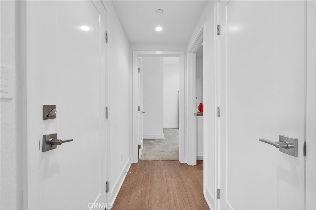 115 Halworth Irvine, CA 92618 - Photo 29 of 33 a view of a hallway with wooden floor