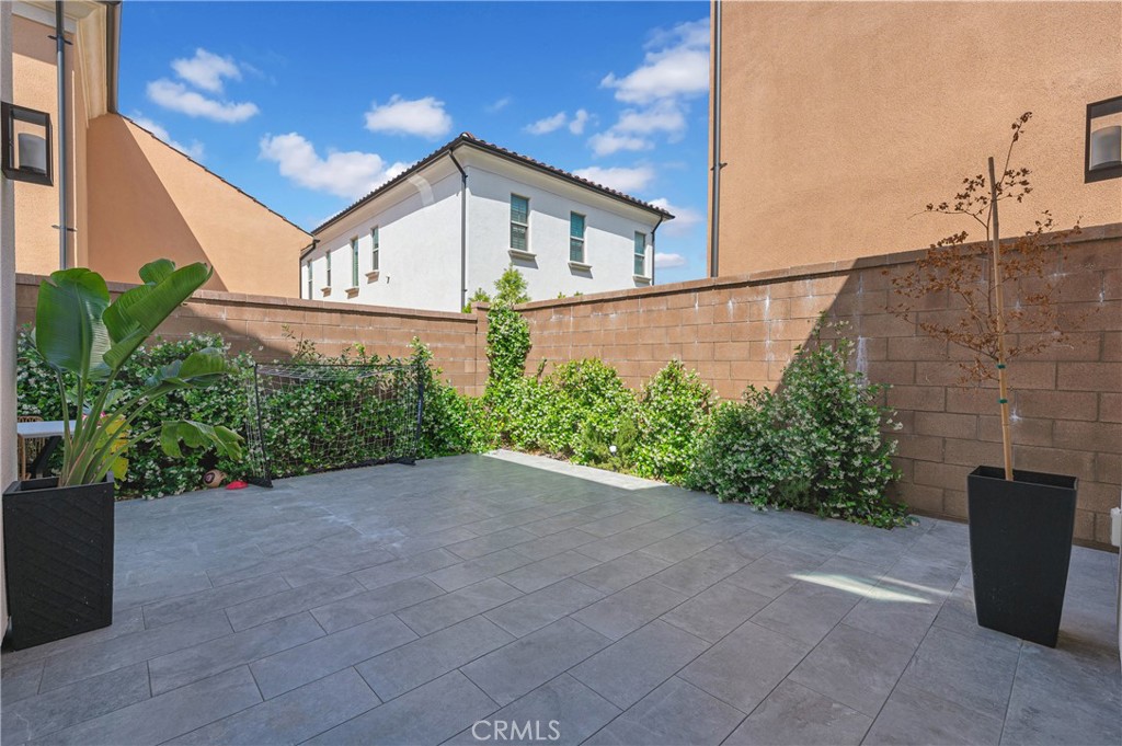 115 Halworth Irvine, CA 92618 - Photo 31 of 33 a view of a back yard with flower plants