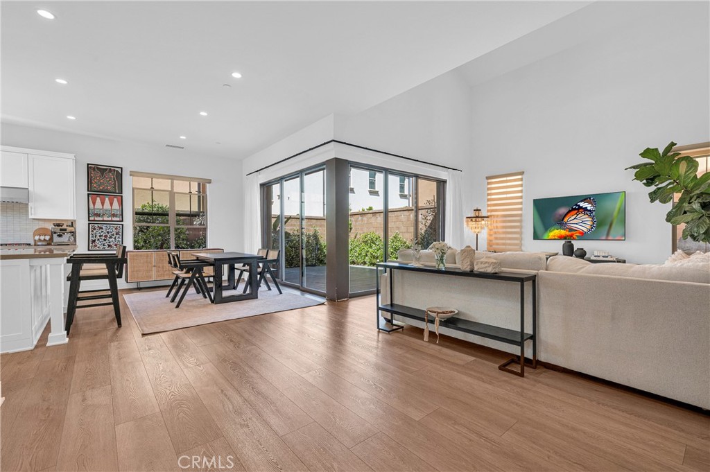 115 Halworth Irvine, CA 92618 - Photo 10 of 33 a living room with furniture and a wooden floor