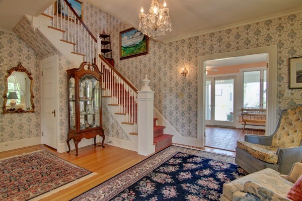 180 Winter Street Woonsocket, RI 02895 - Photo 7 of 29 a living room with furniture and a chandelier