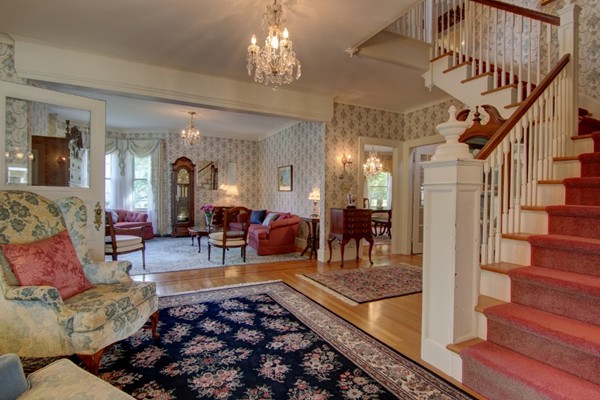 180 Winter Street Woonsocket, RI 02895 - Photo 9 of 29 a living room with furniture and a chandelier