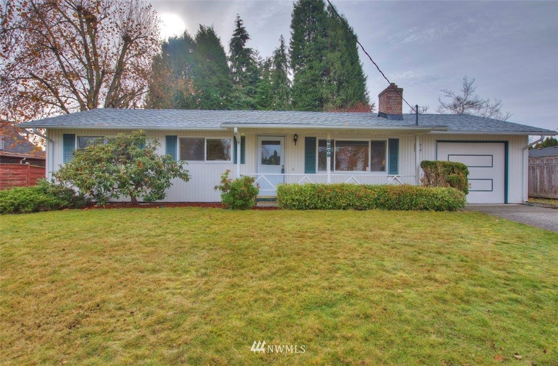 4209 Northeast 11th Street Renton, WA 98059 - Photo 1 of 17 front view of a house with a yard