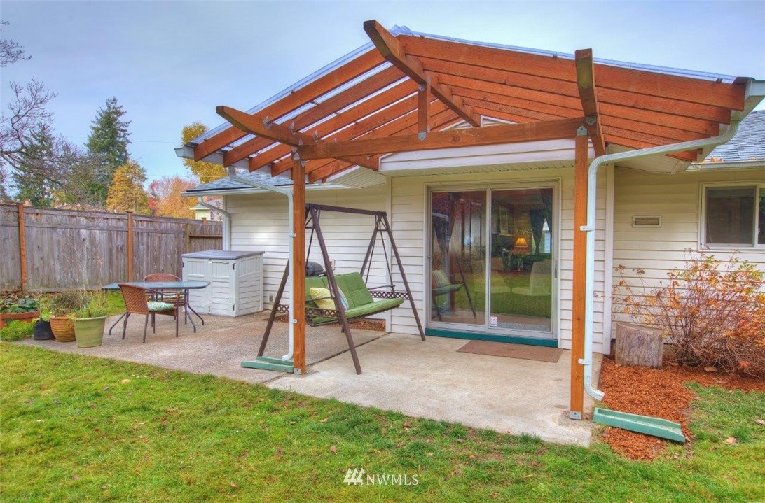 4209 Northeast 11th Street Renton, WA 98059 - Photo 13 of 17 a view of a house with a backyard and chairs