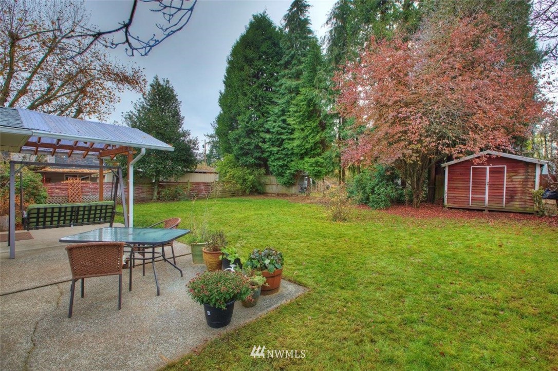 4209 Northeast 11th Street Renton, WA 98059 - Photo 14 of 17 a view of a house with backyard and sitting area