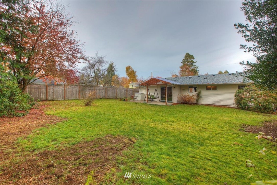 4209 Northeast 11th Street Renton, WA 98059 - Photo 15 of 17 a front view of a house with a yard