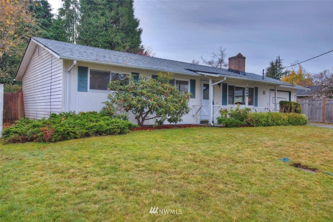4209 Northeast 11th Street Renton, WA 98059 - Photo 16 of 17 a front view of a house with garden