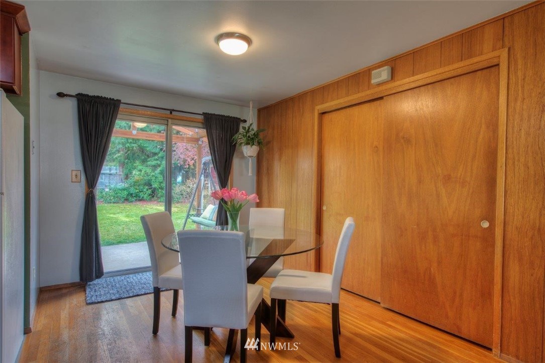 4209 Northeast 11th Street Renton, WA 98059 - Photo 5 of 17 a view of a dining room with furniture window and wooden floor
